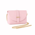 Pink Italian leather mini bag displayed with gold chain shoulder strap laid in front