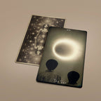 Two Tarot of Unknown Shadows cards lying flat showing The Star and card back design