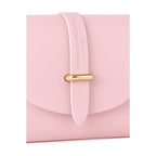 Close-up detail of gold metal loop closure on the front flap