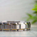 Magnetic Mobility Alexander's Moon 4in1 Magnetic Bracelet – side view – brushed stainless steel links with gold stripes