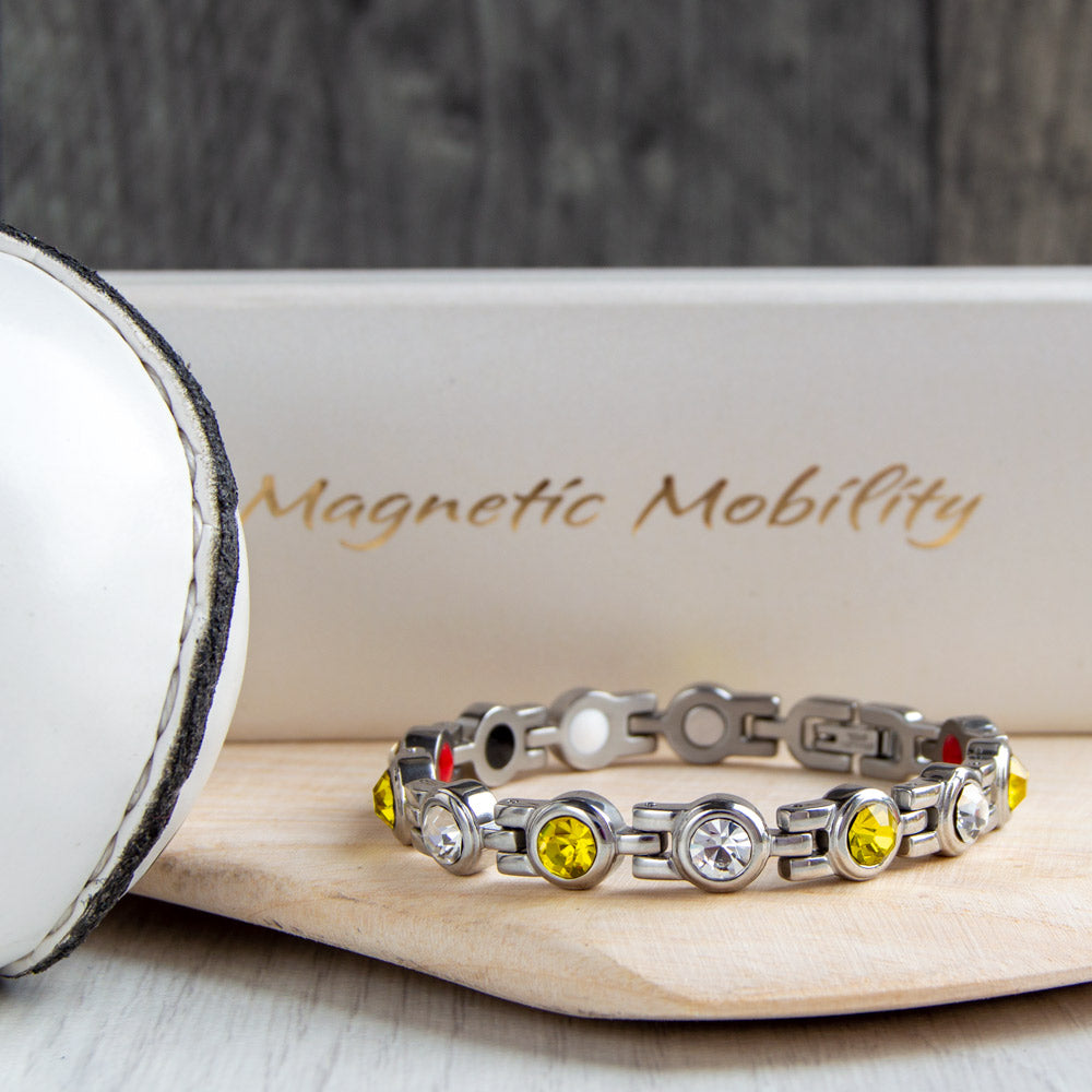 Magnetic Mobility GAA inspired County Colours Magnetic Bracelet – front view – Kilkenny black and amber crystal links in stainless steel.