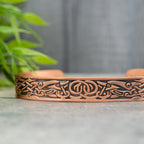 Magnetic Mobility Clover Copper Bracelet – side view – embossed copper cuff with Celtic knot and bird motifs