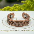 Magnetic Mobility Clover Copper Ring - front view - embossed Celtic knot and bird motif in pure copper.