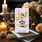 The Golden Path Tarot card Wheel of Fortune displayed with candles