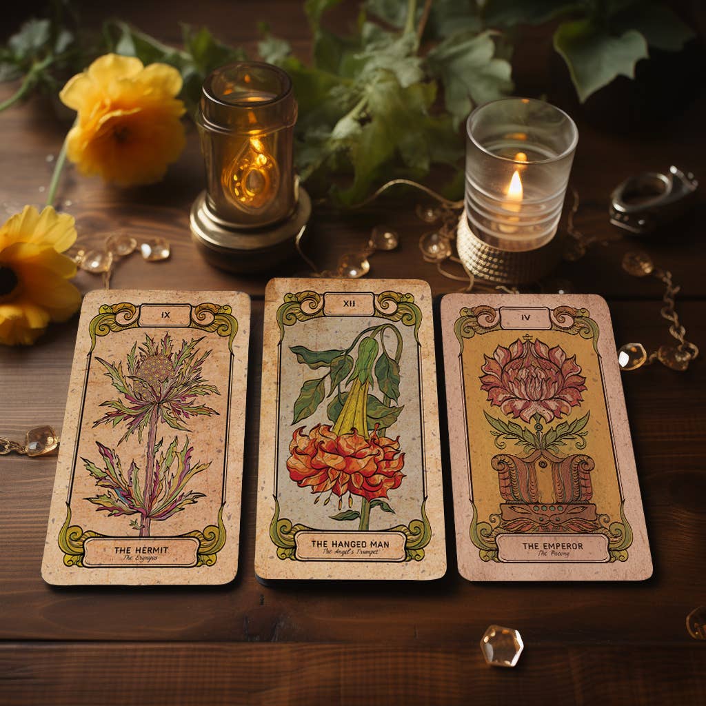 Dark Synevyr Botanica Oculta Tarot Deck 80 Cards - cards displayed on a wooden tray with a lit candle and yellow flowers