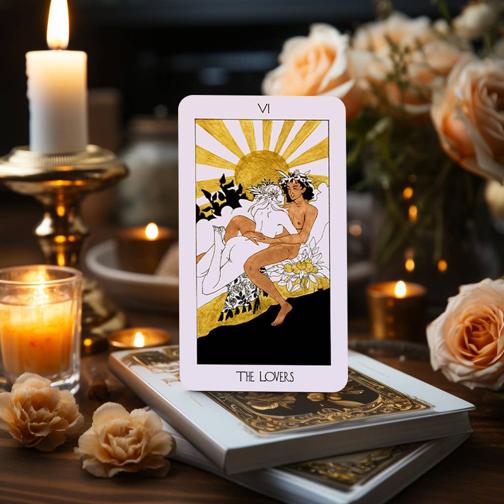 The Golden Path Tarot card The Lovers displayed with candles and roses