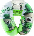 U-shaped travel pillow featuring an illustration of Paddy Bear wearing a green hat and waistcoat, holding shamrocks next to an Ireland sign