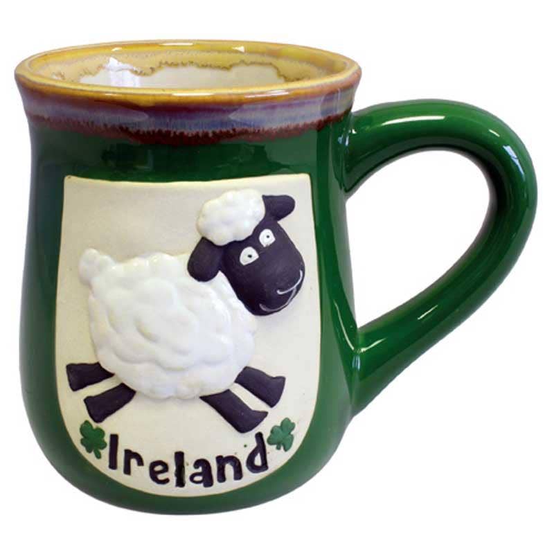 Green pottery mug featuring a white relief sheep design and Ireland text