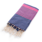 Miami Beach Navy & Fuchsia Fouta Towel, 1x2m, with vibrant fuchsia stripes and tassels, is shown folded on a white background.
