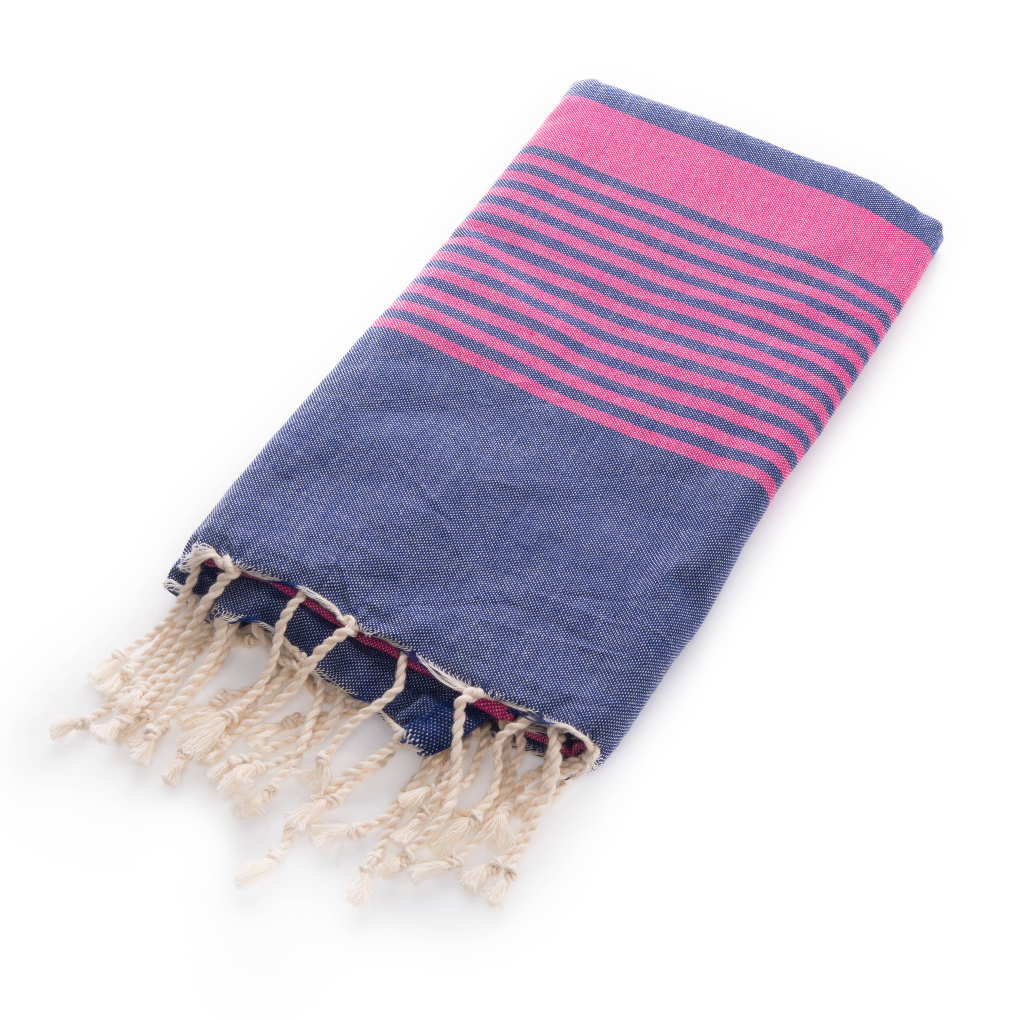 Miami Beach Navy & Fuchsia Fouta Towel, 1x2m, with vibrant fuchsia stripes and tassels, is shown folded on a white background.